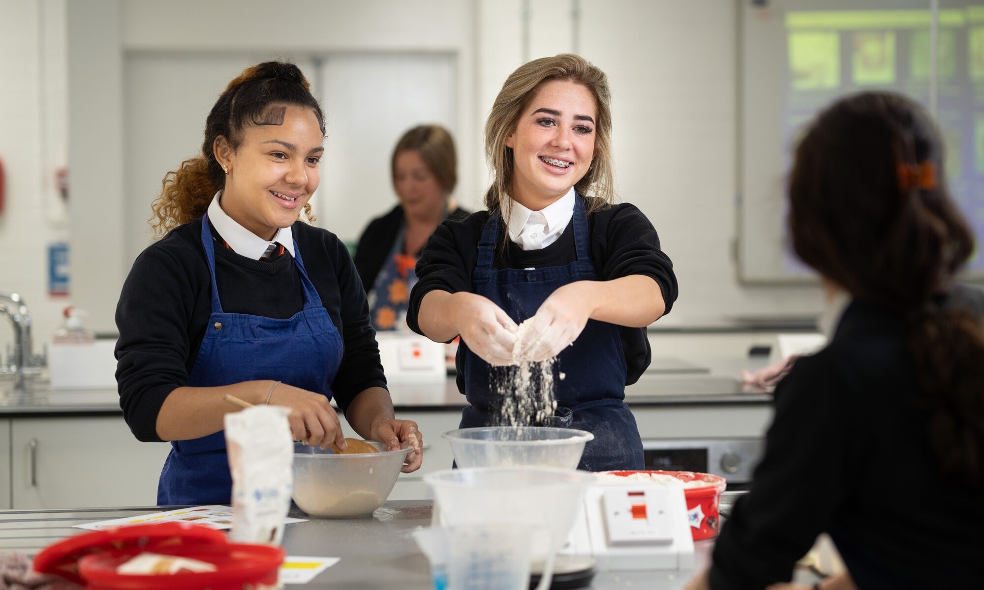 Students learning essential cooking skills
