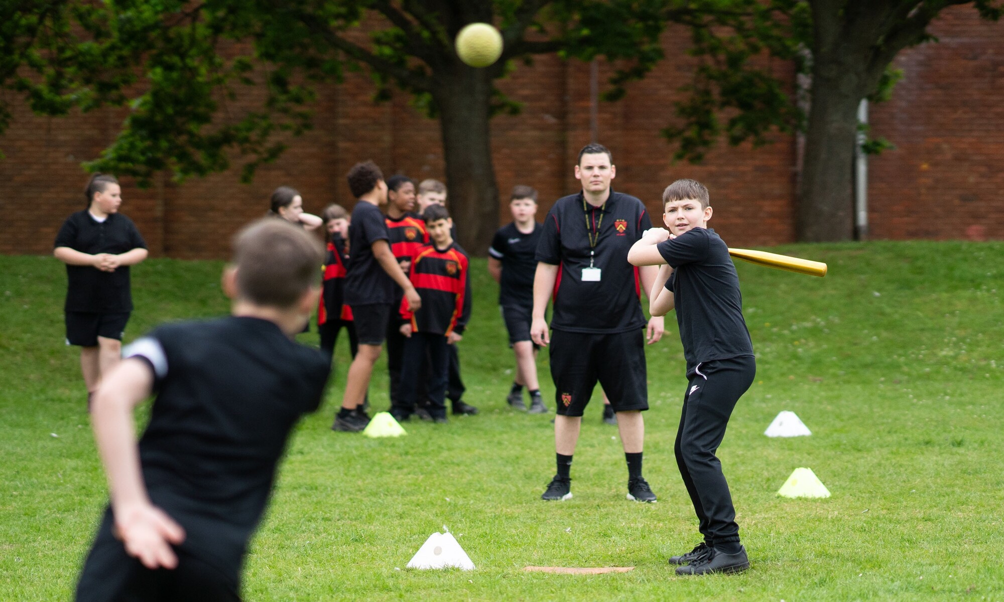 Student ready to strike a Home run during Baseball in PE Class
